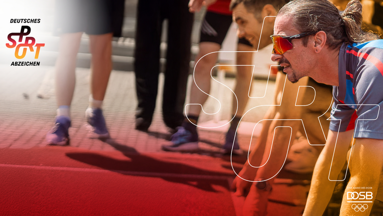Ein Sportler in Startposition beim Sportabzeichen